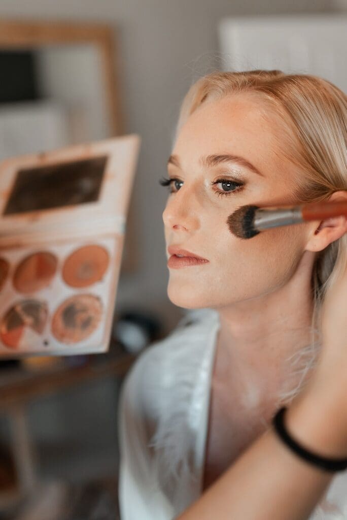 Closeup of bride having her makeup done by KAMU | Kiss & Makeup