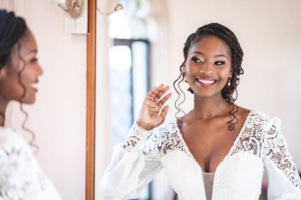 African bride with glamorous makeup done by Blush Pro Make-Up