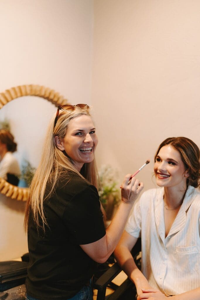 Candice from Blush Pro-Makeup applying makeup to bride