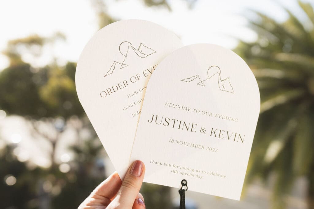Arched welcome card and order of events with personal logo