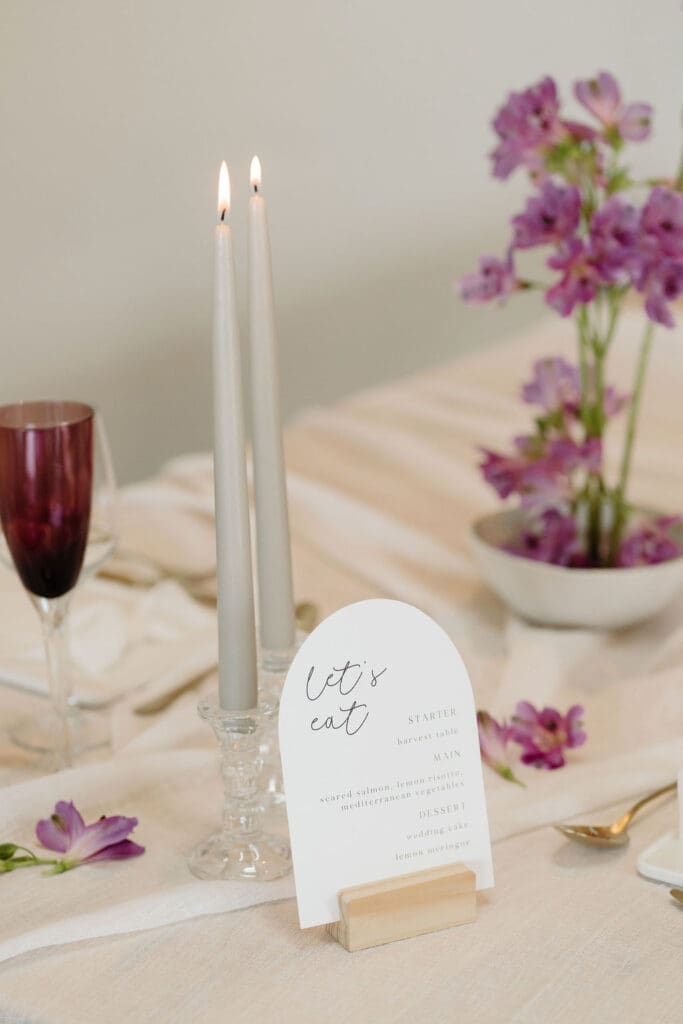 Arched menu card ontop of table.