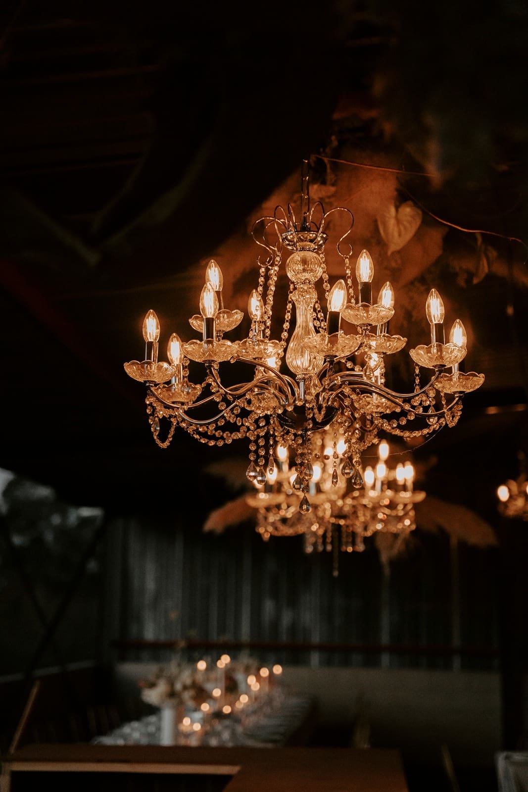 Beautiful floral and tear drop chandelier illuminated in darkness