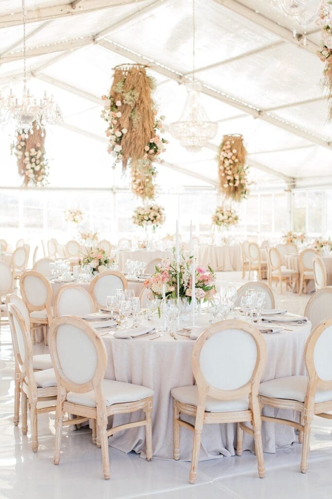 Hanging floral installations and round wedding table decor