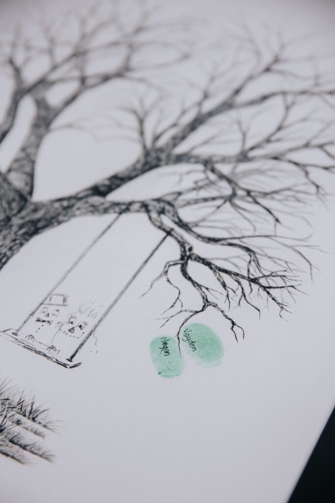Close up of wedding guest book by Fingerprint Trees.